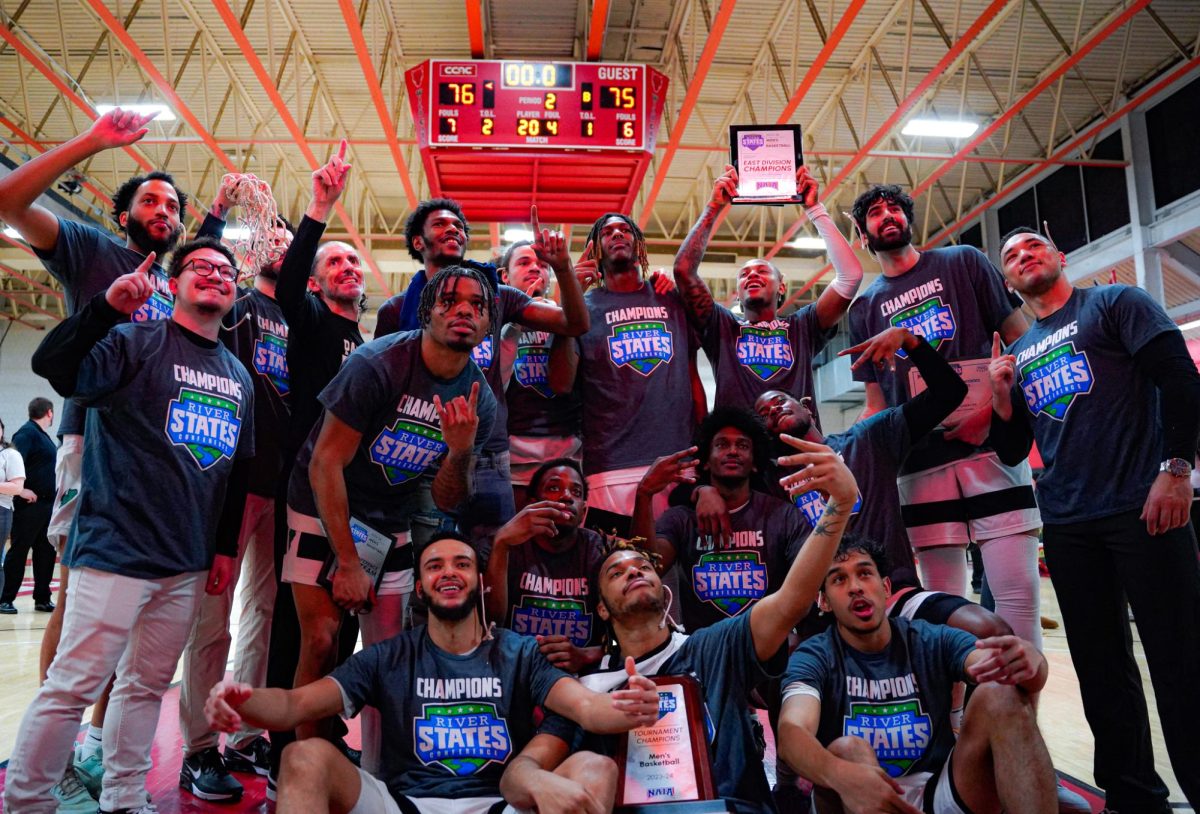 The Point Park men's basketball team celebrates its River States Conference Championship win in March.