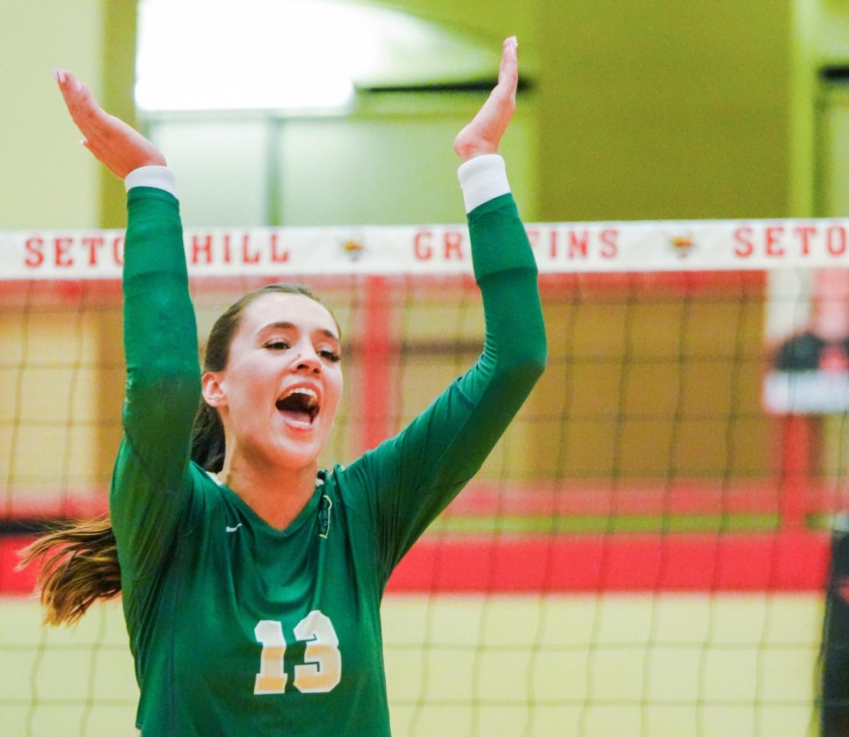 Senior Eden McElhaney celebrates a point against Seton Hill. 