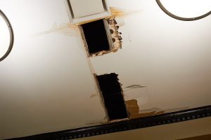 The ceiling above the checkout area in Point Cafe, which was damaged by a leaky pipe. 