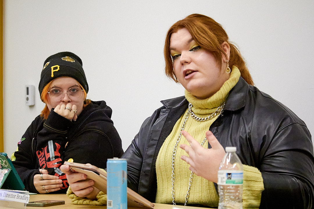 SGA Senators Bee Pugh and Hunter Bradley talk during the Nov. 18 SGA meeting. 