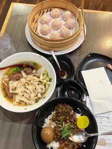 (Top to bottom) Fresh dumplings, pork rib noodle soup, and minced pork over rice and egg. 