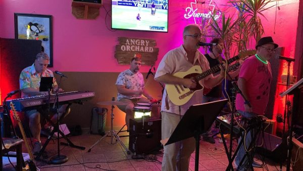 Eric Joseph, front, plays guitar and sings with his bandmates in The StreetSide Saints. 

Photo courtesy of The StreetSide Saints