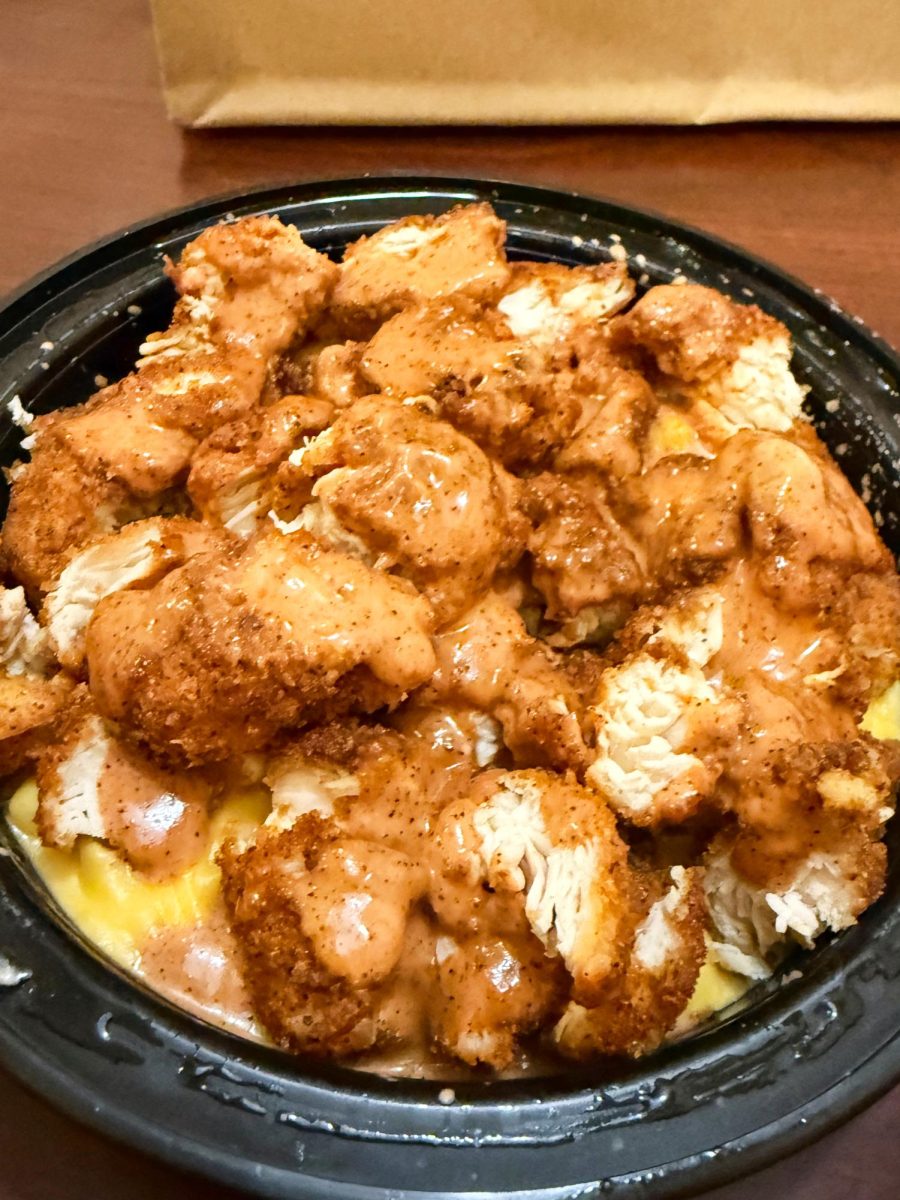 The "Mad and Cheese" bowl from Mad Chicken sits on a table, uneaten.