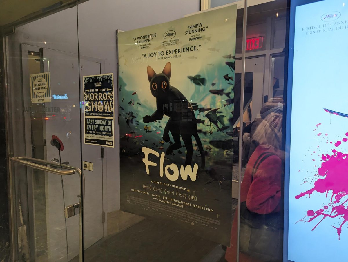 A poster for "Flow" at the Harris Theater on Liberty Avenue.