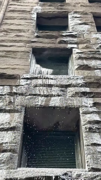 Water freezes and trickles down the Granite Building on Sixth Street.