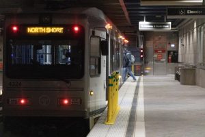 A "T" light-rail train stops to pick up passengers in Wood Street Station.