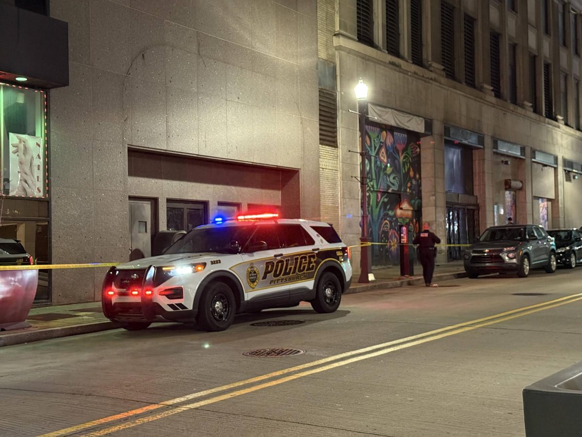 Pittsburgh police contain a crime scene on Forbes Avenue where evidence of a shooting was found. 