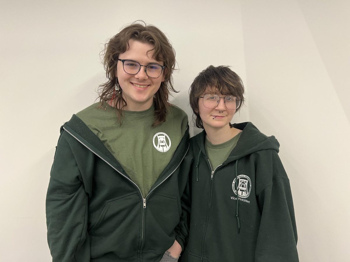SGA President Kyle Maclaughlin (left) and Vice President Dillon Peterson (right) pose for a photo after SGA's final meeting. 