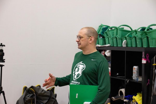 Coach Lamplot discusses bodily recovery with the team. 