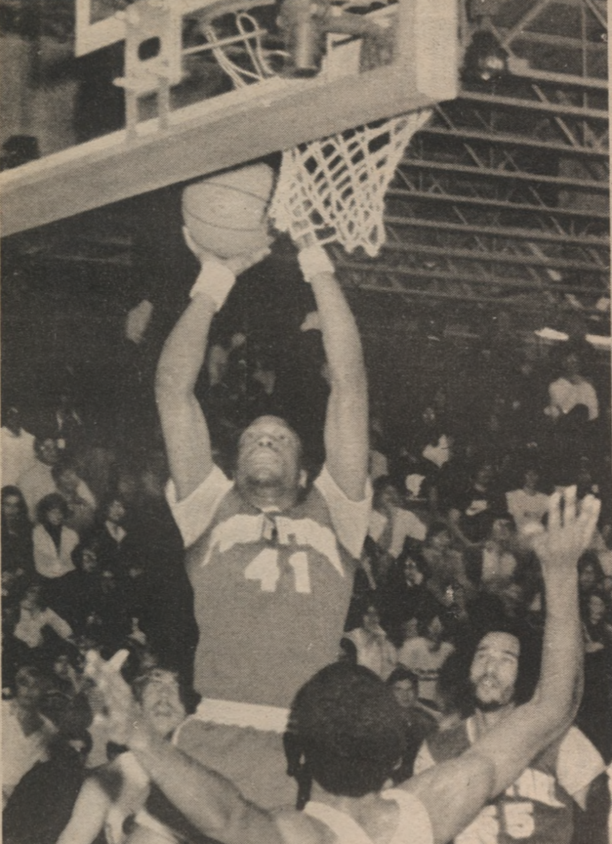 Point Park men’s basketball forward Terry Parham fakes his opponent for two points. The Pioneers were playing against the Behrend Cubs in the old Mellon Arena. Photo taken Feb. 5, 1980.