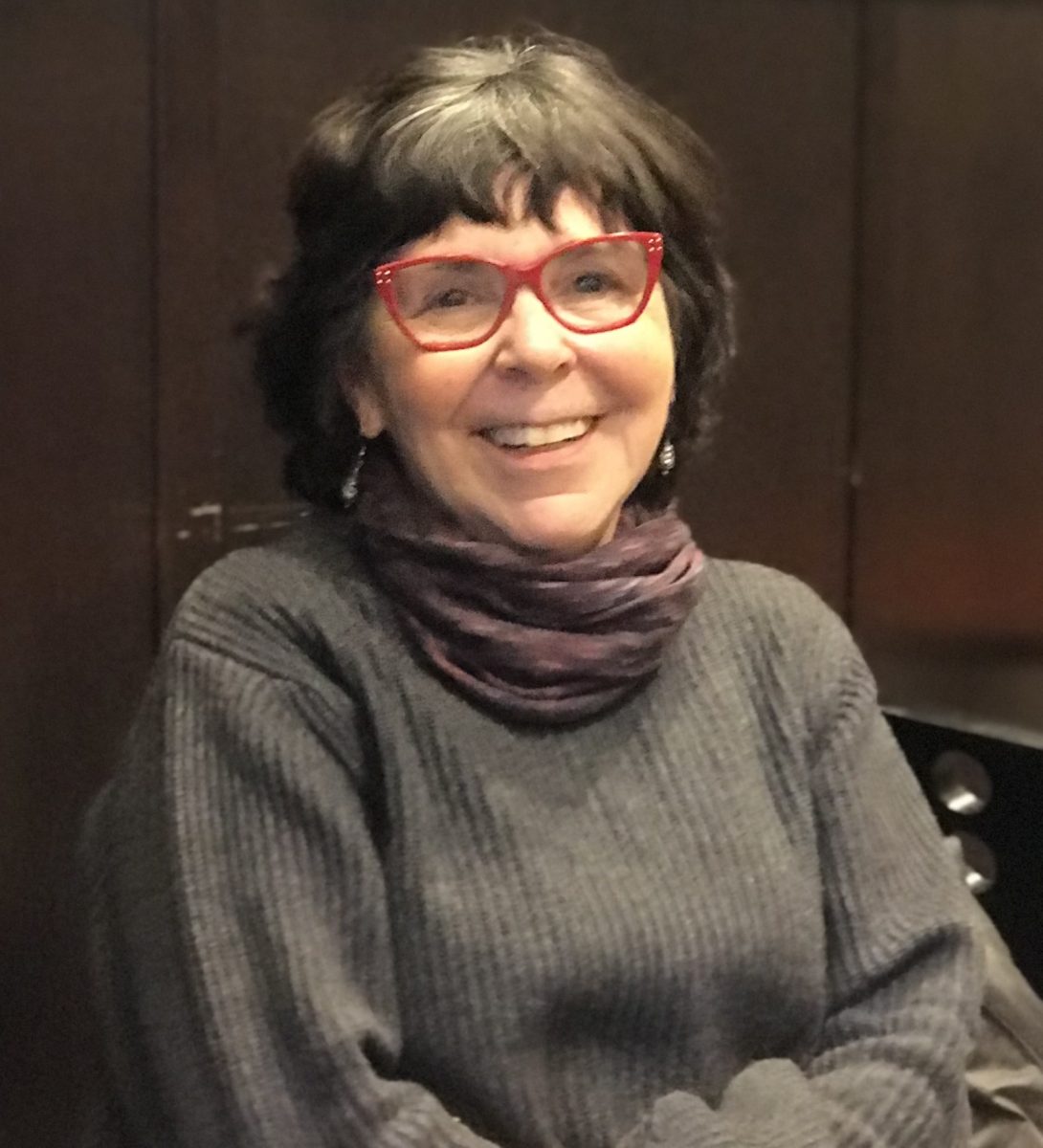 A portrait of the author, Kate Daher.