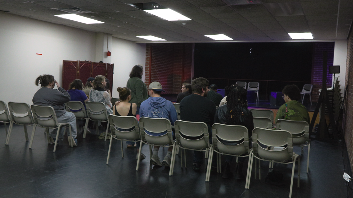A student audience prepares to watch this year’s Fringe Festival in a Boulevard Apartments theater.