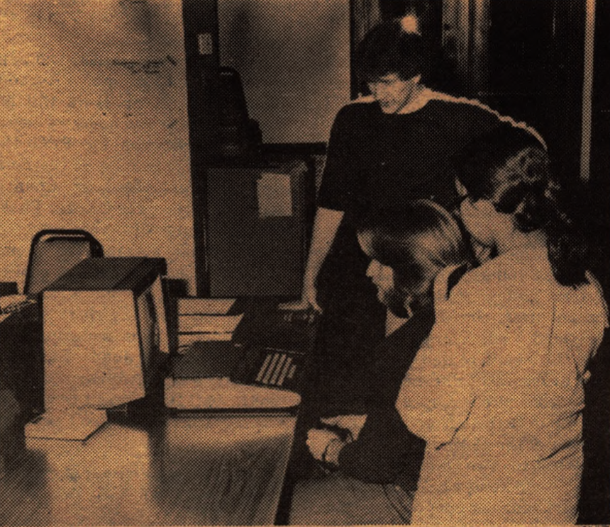 Engineering students hold a competition over who can get the best high score on a Space War computer game. Photo taken March 4, 1982.