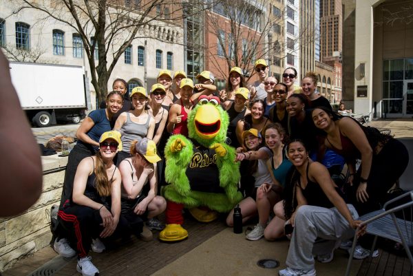 Pittsburgh Pirates mascot Pirate Parrot poses with Point Park dance majors in Village Park on April 2 to promote “Point Park Night” at PNC Park, which took place on April 14.