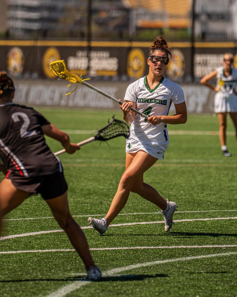 Andrea Kinger searches for a pass vs. Frostburg St. on April 17.