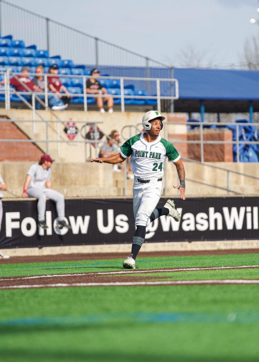 Trevor Jones runs home in Game 2 vs. Fairmont State.