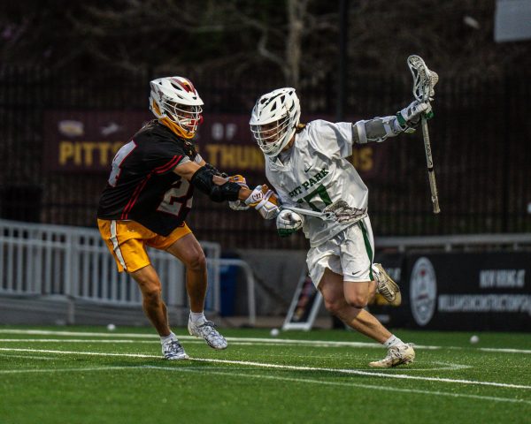 Freshman Parker Bowersox dodges a Seton Hill defender at Highmark Stadium on April 8.